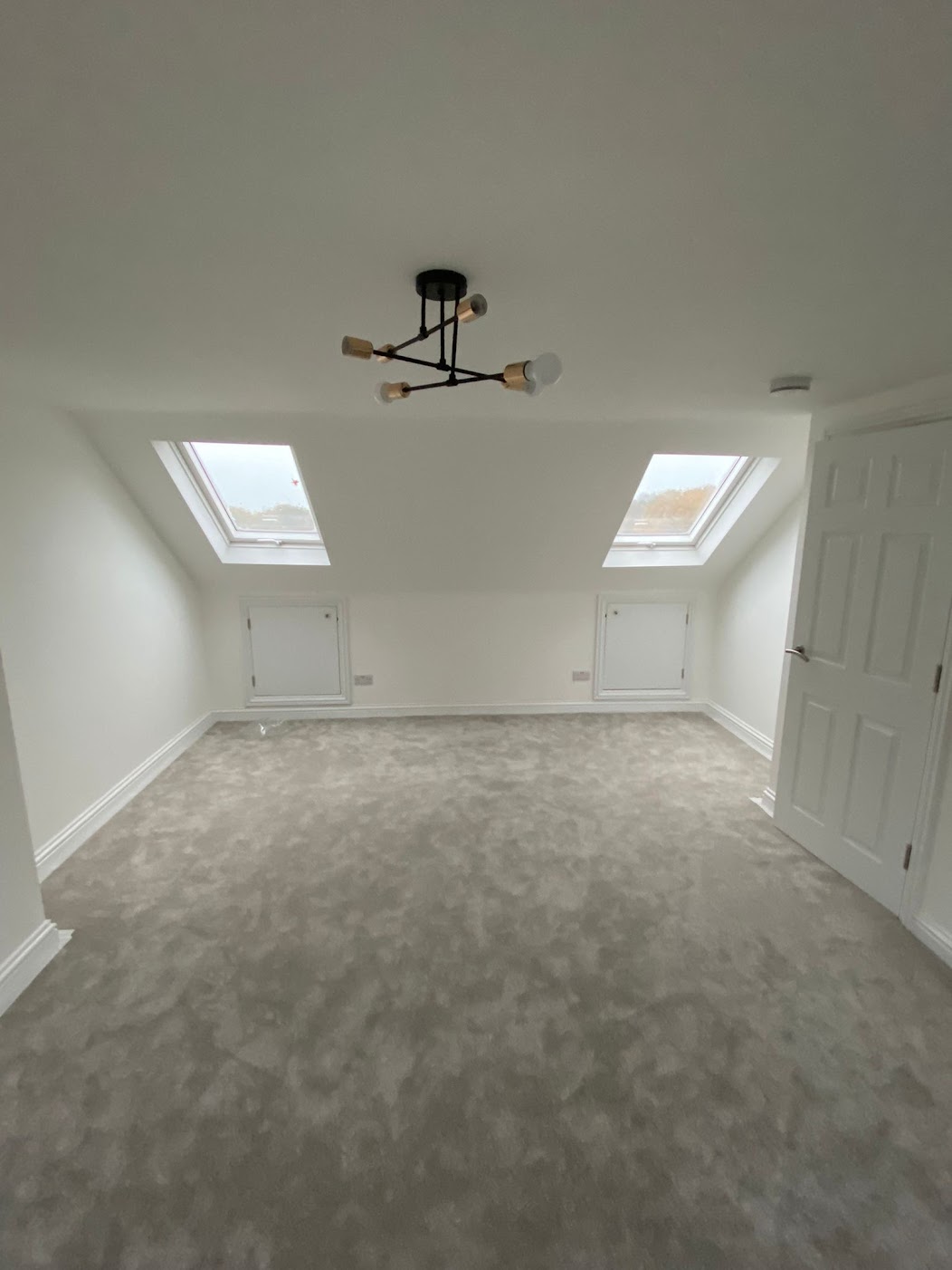 Converted loft space, with Velux style windows and freshly laid carpet.