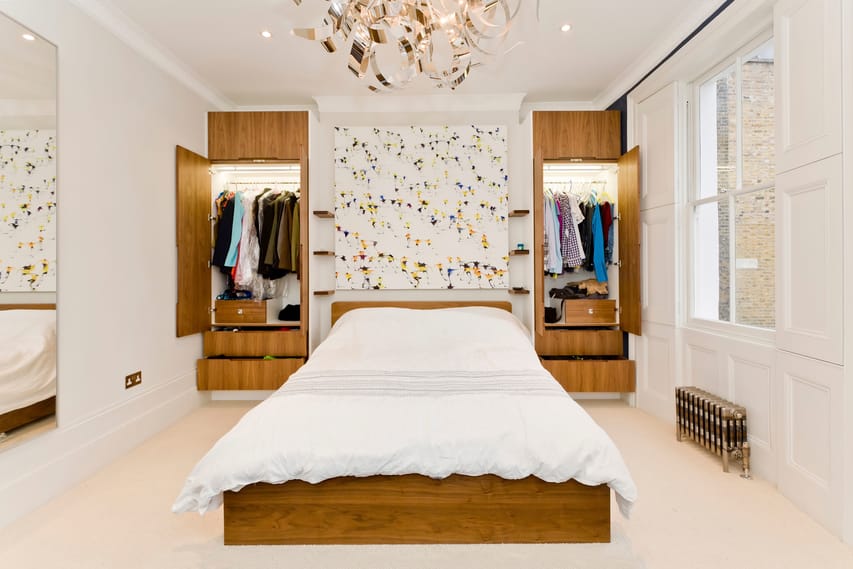 Newly fitted bespoke wardrobes either side of a double bed